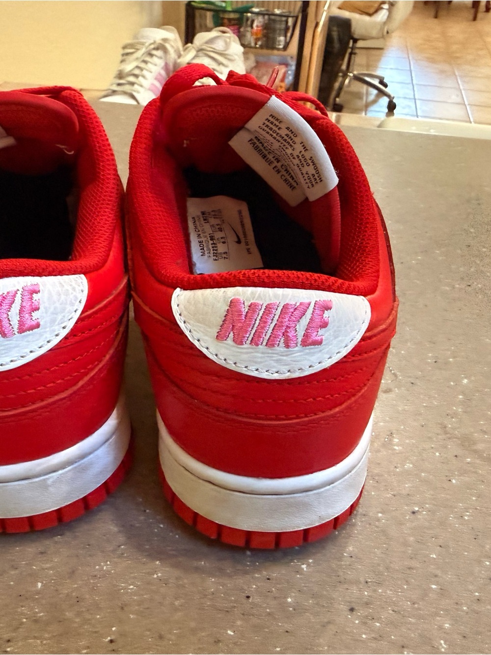 Nike Red and White Low-Top sneakers. Pink Nike at heel and gold emblem - Picture 3 of 4